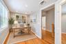 bonus room ideas great for office Recessed lighting, wood-finish flooring, white built-in shelving, and a window with blinds