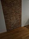Room details with visible vents, baseboards, and wood finished floors