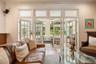 Family room leading to light and bright sunporch.