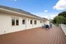 Upper deck runs the length of the home with access from upstairs bedrooms.