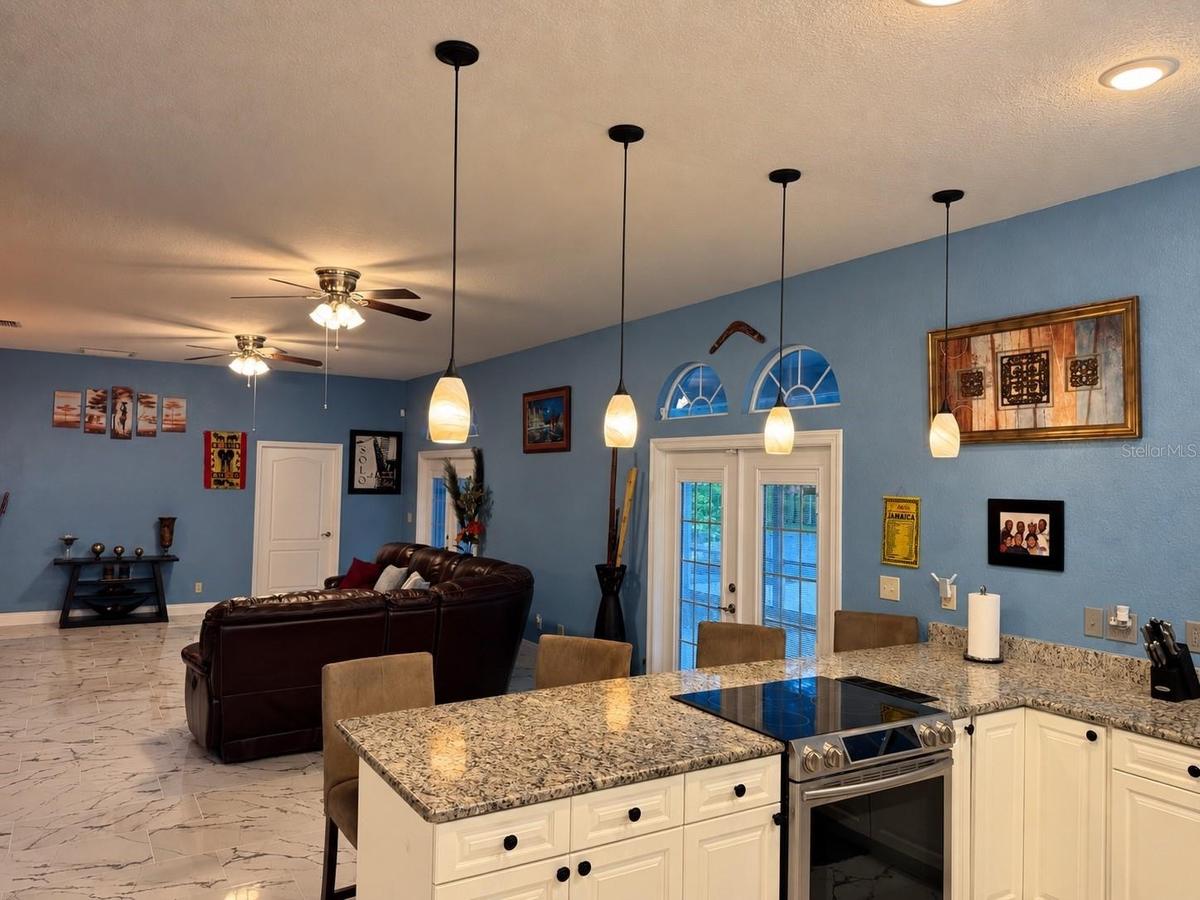 White cabinets and view to living room. Great for entertaining!