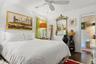 White walls featuring dark wood-finish flooring