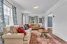 Hardwood flooring, painted white walls, recessed doorway, and a ceiling-mounted light fixture