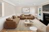 Family Room - hardwood flooring, crown molding, wainscoting, recessed lighting, and fireplace with a mantel.VIRTUAL STAGING.