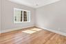 THREE additional bedrooms with hardwood flooring, crown molding, recessed lighting, white window trim, and white baseboards