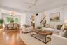 Virtually staged living room and dining room.