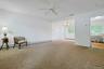 View of living room, kitchen and dining room.