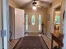 Center hall entry flows to living area and bedrooms with central access to deck and parklike yard