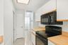 A spacious kitchen layout with generous counter space.