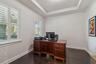 A spacious private office near the entry, set apart from the main living areas