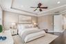 Virtually staged primary bedroom illustrating one way to furnish the space.