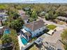Aerial view of the house, showcasing the expansive backyard and surrounding landscape.