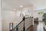 A second view of the upper hallway and open foyer.