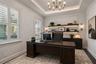 Virtually staged office space illustrating one way to furnish the space.