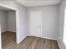 Foyer, open door to Office 2 and closed door to Office 3.