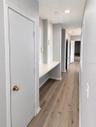 Hallway, closet door, and small counter.