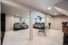 Recessed lighting, light-toned carpeting, and a built-in projector
