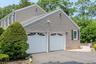 Two-car garage with white paneled automation doors