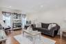 Recessed lighting, crown molding, wood-finish flooring, and white wall finishes