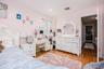 Bedroom 3 recessed ceiling lighting, wood-finish flooring, and a window with natural light