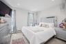 Bedroom 2 recessed lighting, two windows with natural light, and two decorative ceiling fixtures