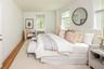 Large primary bedroom with lake views