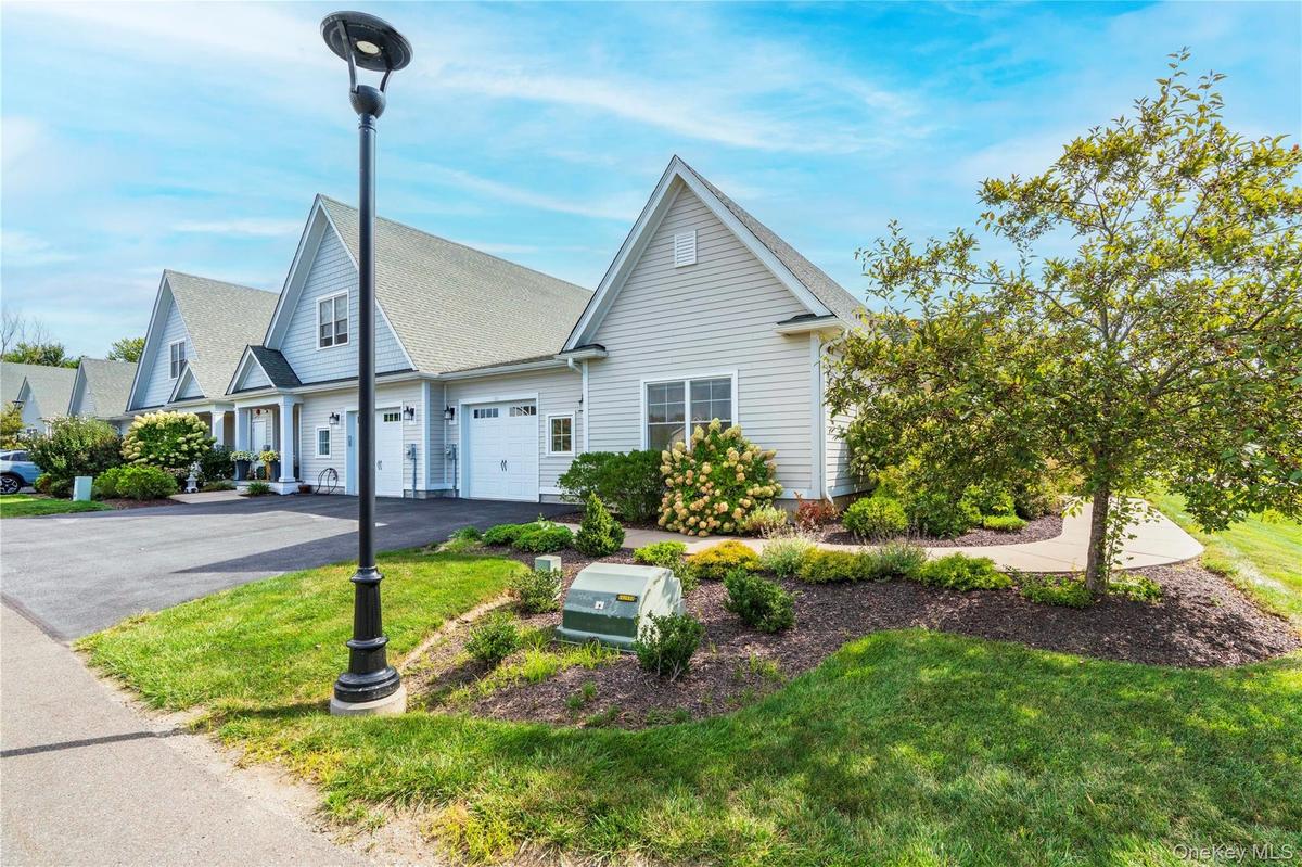 An Attached One Gar Garage & Paved Driveway