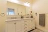 Double Sink Marble Top Vanity & Large Tiles Walk-in Shower
