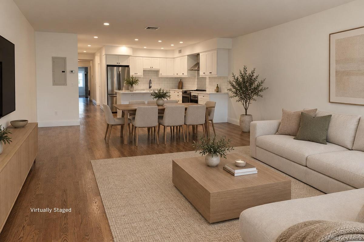 VIRTUALLY STAGED  Great room from front windows towards kitchen