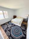 Hardwood-style flooring and light-colored walls