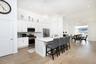 Island Kitchen Featuring Quartz Countertops and Stainless Steel Appliances
