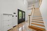 Grand two story foyer with marble tile.