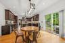 Dining room, with Anderson slider, that leads to a stamped concrete patio. Open to kitchen. Recessed lighting, wide plank white oak flooring and 9 foo