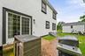 Stucco exterior, back Anderson slider, shed, stamped concrete patio, Bilco door to crawl space ( standing room) Buried owned propane tank and access t