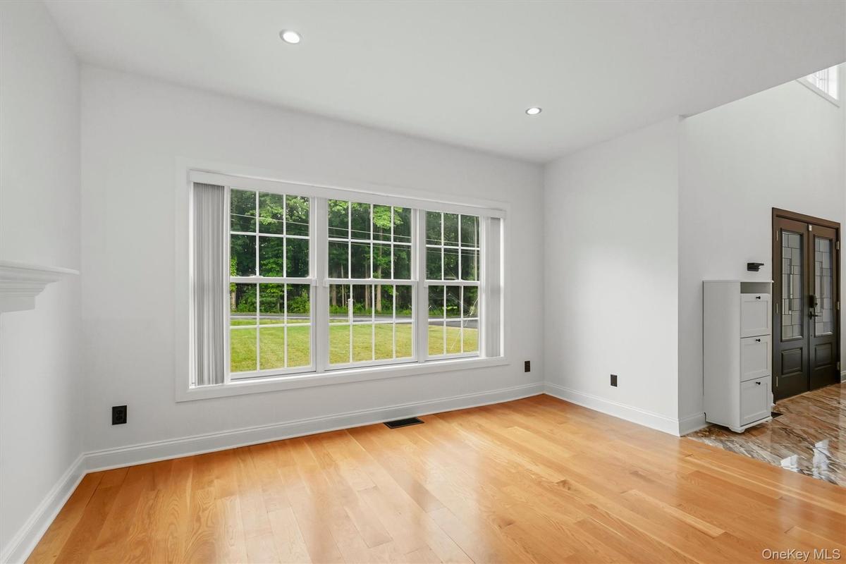 Formal living room, recessed lighting, wide plank white oak flooring, Anderson windows and 9 foot ceilings.