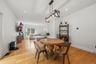 Dining room, with Anderson slider, that leads to a stamped concrete patio. Recessed lighting, wide plank white oak flooring and 9 foot ceilings.