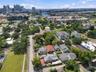 this property is fronted by N Highland Ave with an Alley across the north side