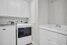 Full Size Laundry Room with Utility Sink and Storage