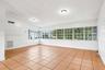 Bright family room with a wall of windows