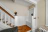 A unique pew incorporated into the staircase reflects the home’s history