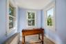 Bright sitting area with windows on three sides and plenty of natural light