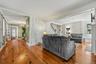 Spacious living area with beautiful wood floors and original character throughout.