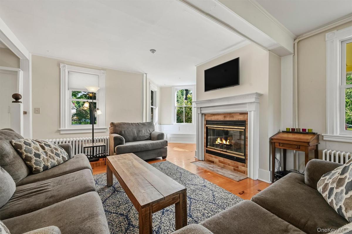 Inviting living room with fireplace and abundant natural light