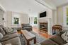 Inviting living room with fireplace and abundant natural light