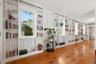 Floor-to-ceiling bookshelves add character and storage to the main living space