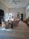 Central Living room with access to pool area and entertaining kitchen island