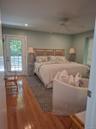 With Ensuite Shower Bath and sitting area with access to side deck and pool area