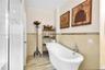 Spa-inspired primary bathroom with freestanding soaking tub