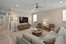 Virtual staging. Spacious family room with full impact windows and natural lightimpact windows