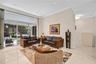 Full impact doors. Spacious living room with natural light and open layout